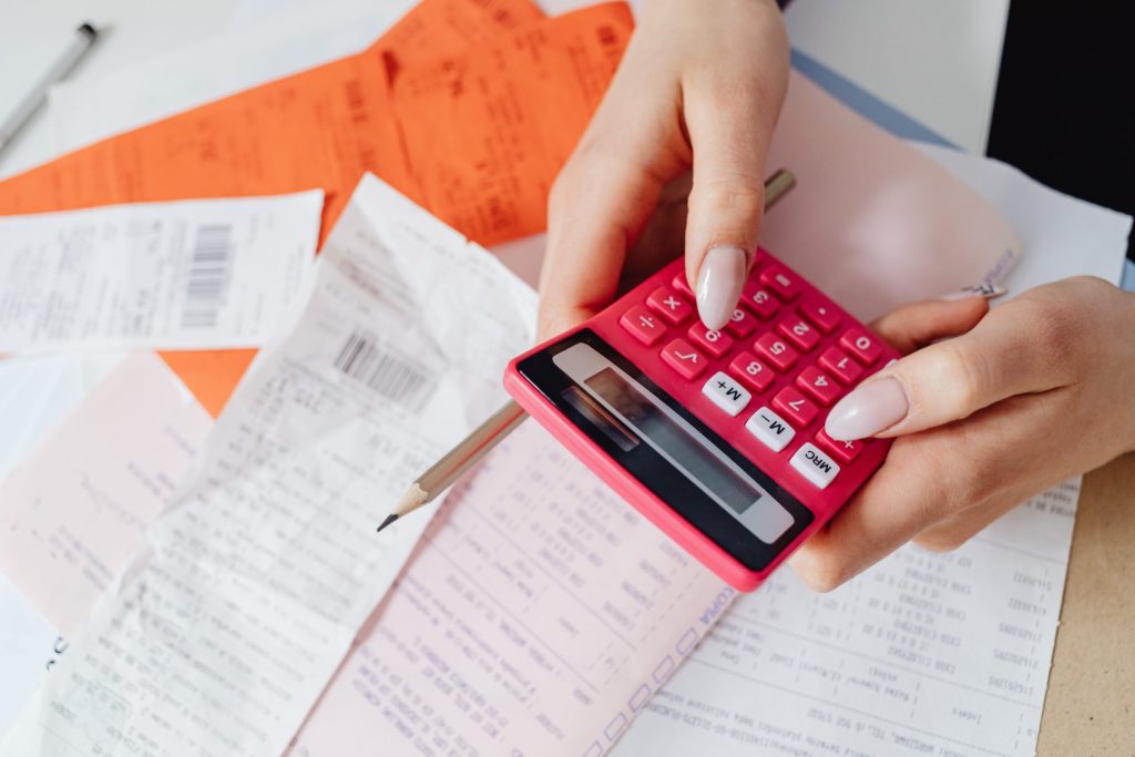Close-up of a person using a calculator
