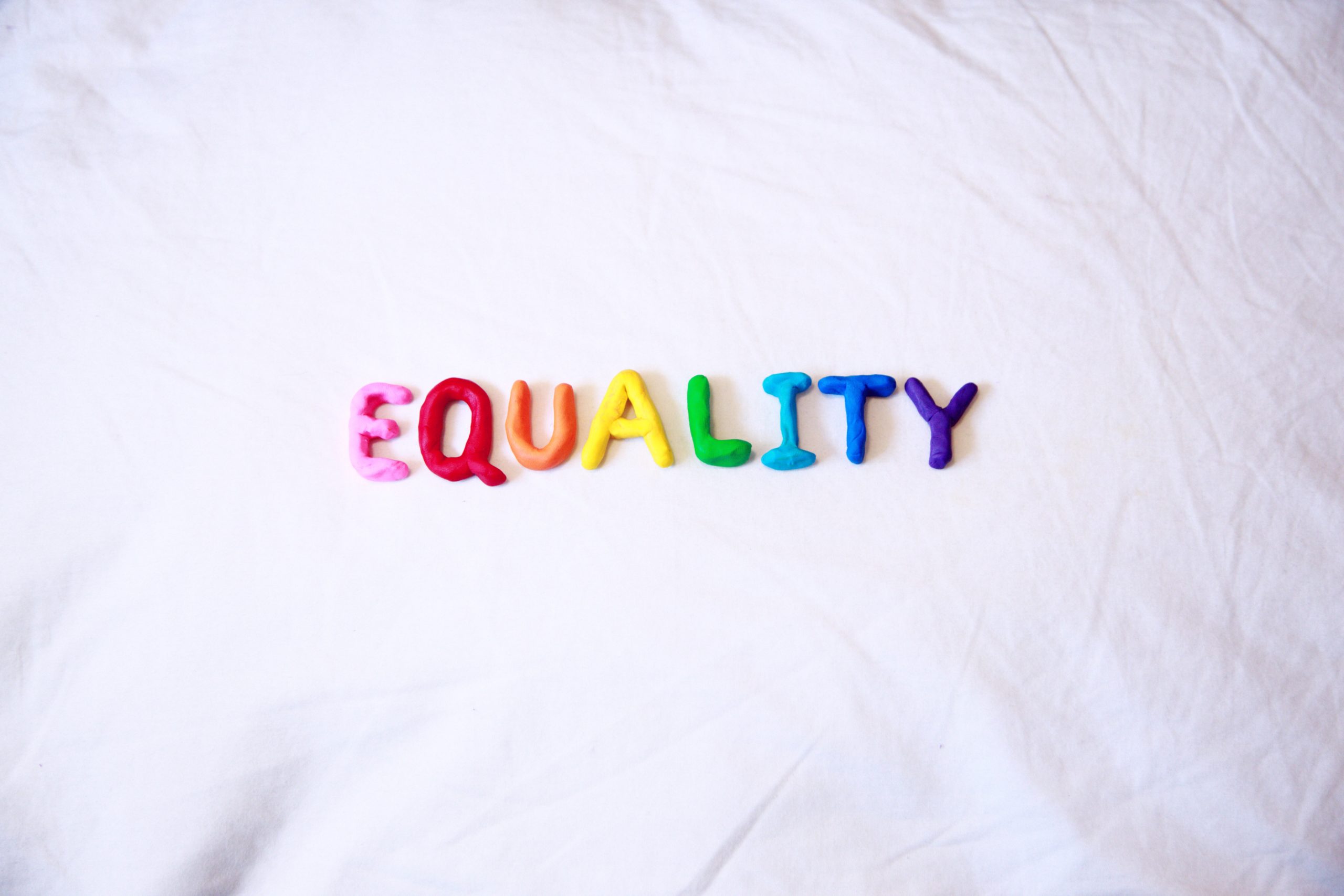 The word equality in rainbow colors.