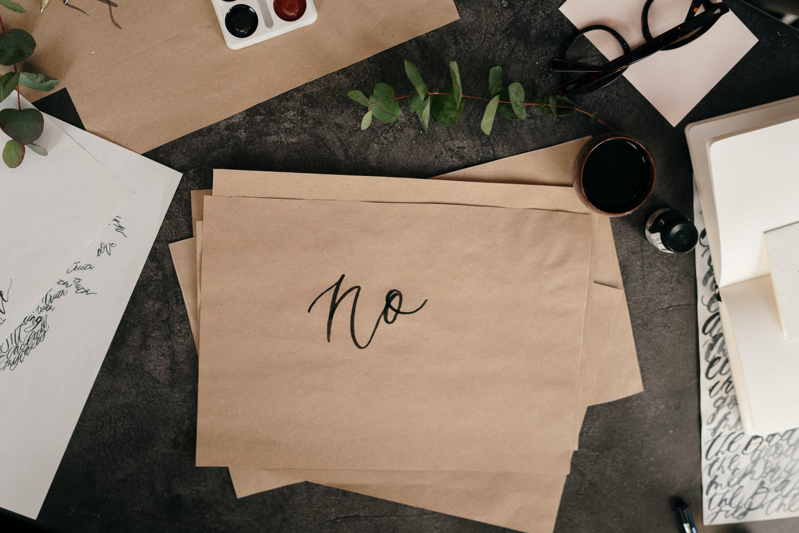 The word “no” written on brown paper