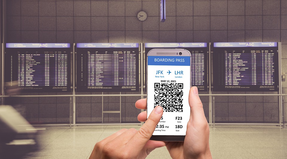 A passenger accessing his flight details by scanning a QR code