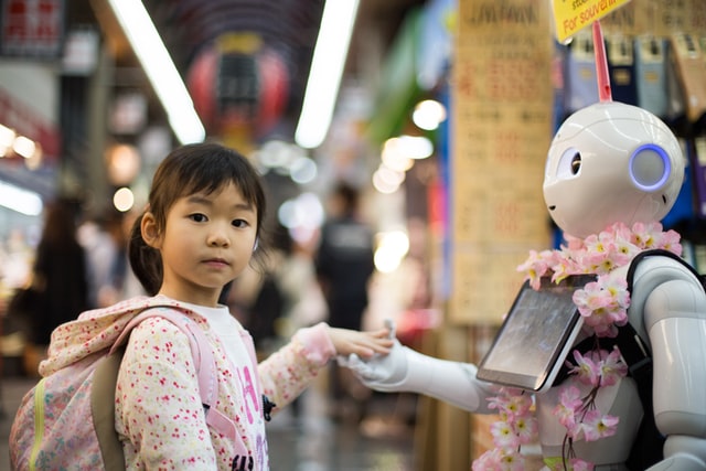 Little girl with an AI robot