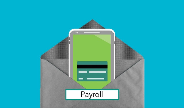 An envelope labeled “payroll” containing a smartphone with a credit card image on the screen.
