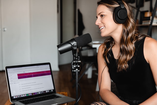 Woman presenting a podcast