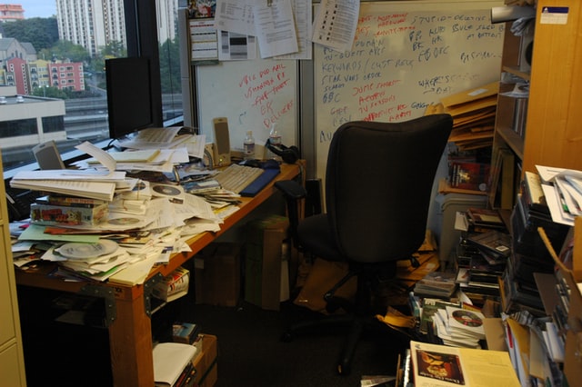 A messy office room representing a toxic office culture.