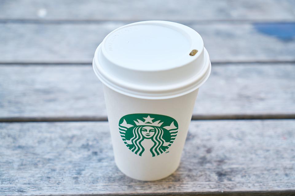Image of Starbucks’ iconic white to-go coffee cup.