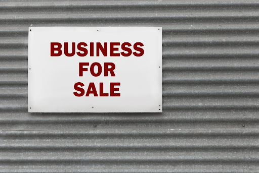 Business sale sign on a metal background.