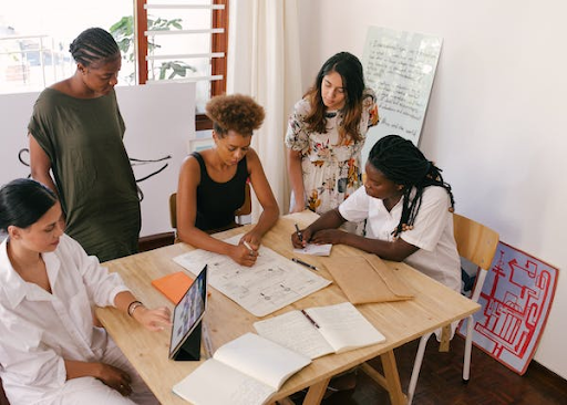 Entrepreneurs brainstorm business goals.