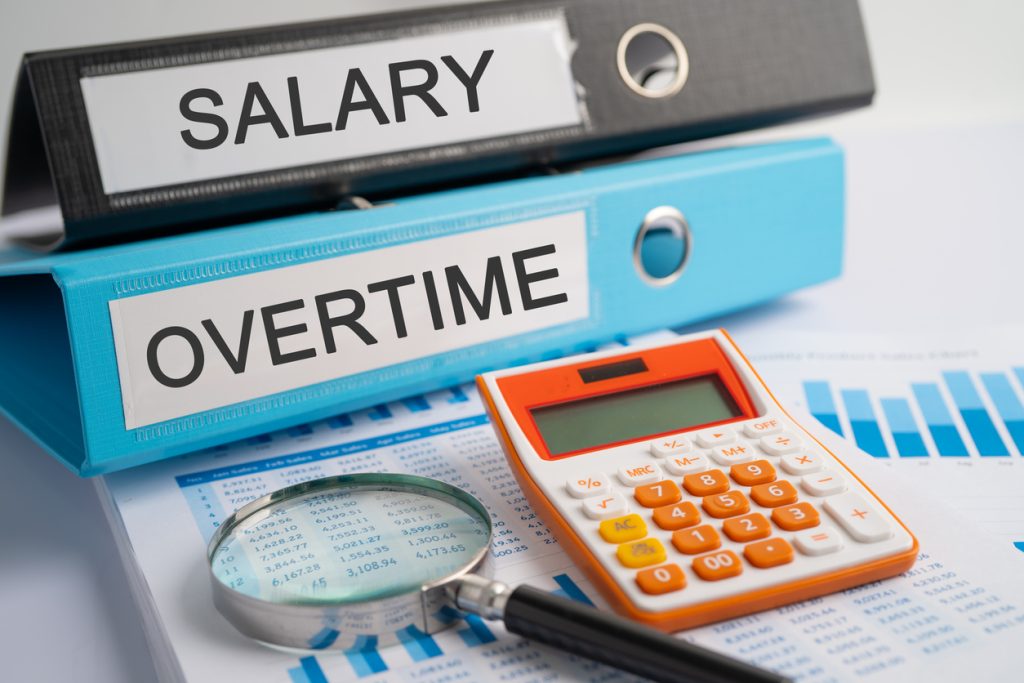 Reviewing payroll processes for ensuring compliance with overtime pay ruling.