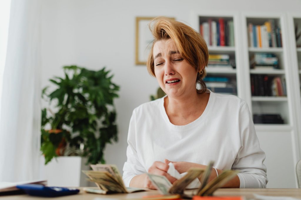 A business owner distressed about sunk cost fallacy.