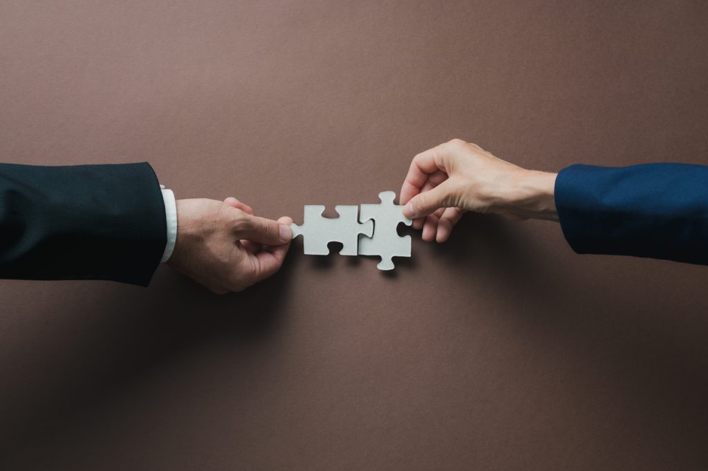 Businesspeople contemplating a reverse merger