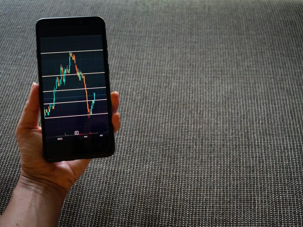 Smartphone depicting stock trading graph
