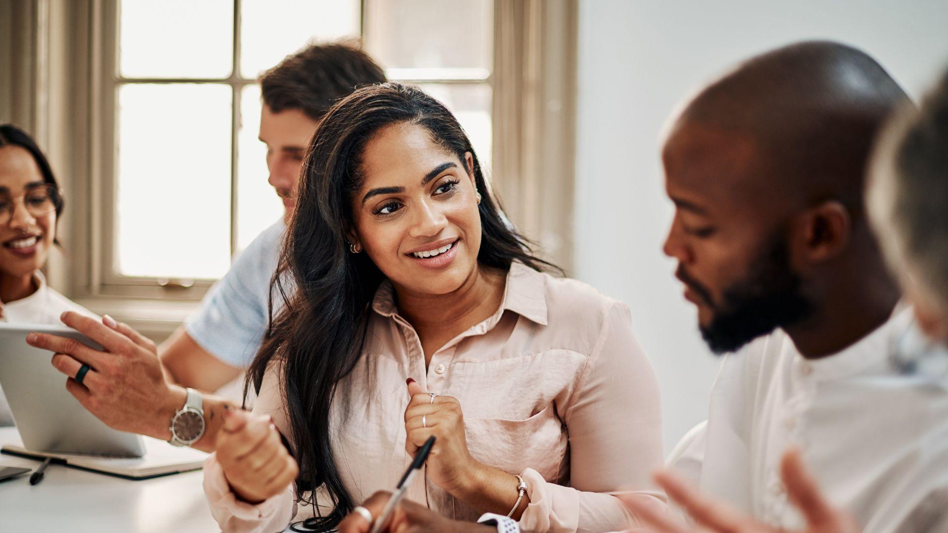 diverse-employees-in-an-office-talking-about-recruiting-challenges