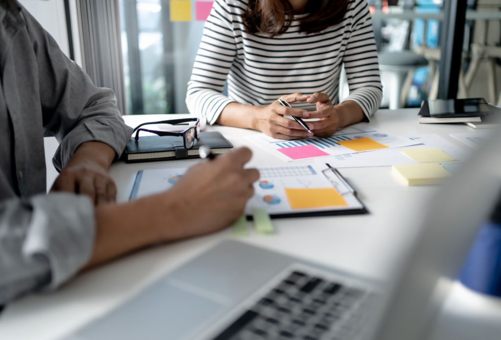 Small business owner reviewing employee benefits strategy and HR compliance checklist