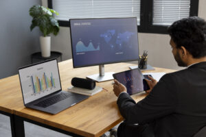 Startup founder reviewing outsourced accounting monthly close package and pricing tiers with finance partner