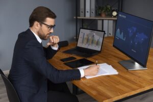 Finance team calculating stock-based compensation expense over vesting period using ASC 718 fair value model